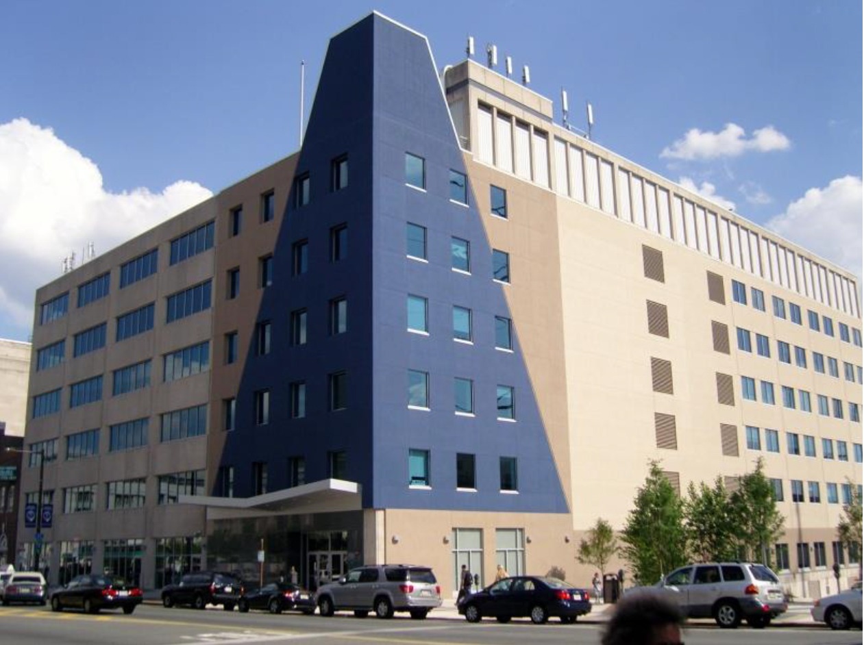 Modern building featuring a distinct blue triangular facade