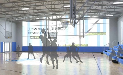 Basketball players in action within a bright