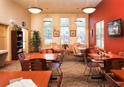 Cozy community dining area with wooden tables and chairs
