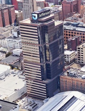 Modern skyscraper with "Jefferson" signage