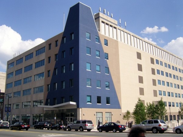 Modern building featuring a distinct blue triangular facade